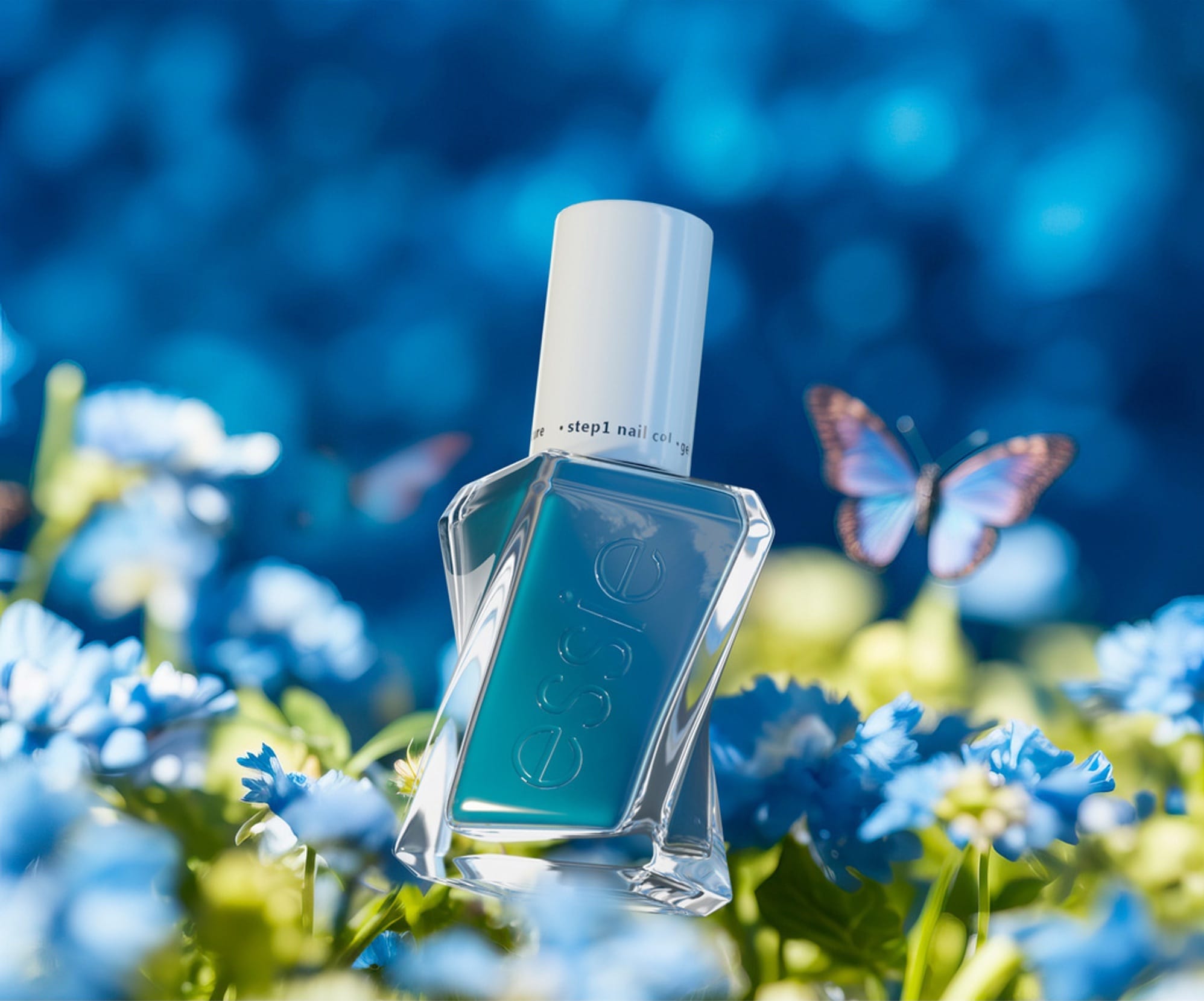 A teal Essie bottle set in a field of small blue flowers, a butterfly resting nearby.
